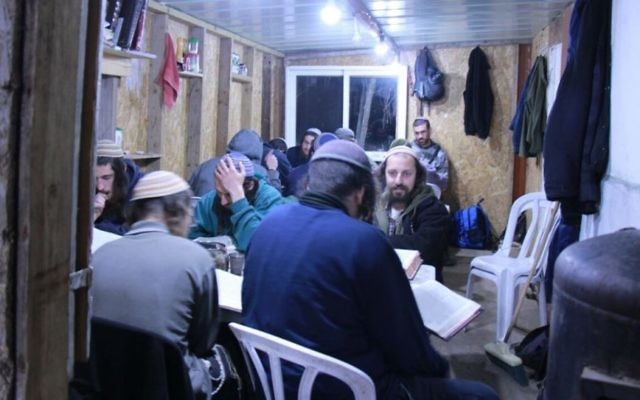 Yeshivat Homesh students pictured in their study hall that lies on top of the evacuated settlement of Homesh. (Courtesy: Yeshivat Homesh)