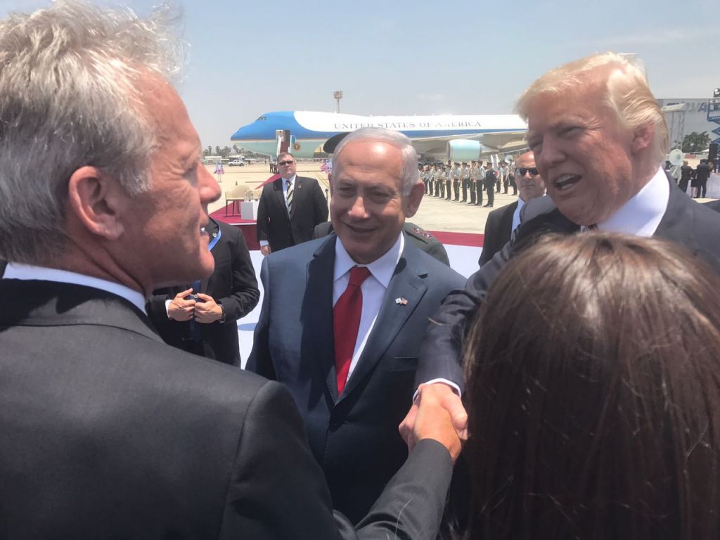 Arriving in Israel, US President Donald Trump shakes hands with former US ambassador to the US, Deputy minister Michael Oren MK, at Ben-Gurion Airport on May 21, 2017 (Courtesy)