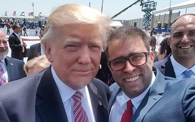 US President Donald Trump poses for a selfie with MK Oren Hazan at Ben Gurion Airport on Monday, May 22, 2017. Prime Minister Benjamin Netanyahu's hand can be seen in the lower right-hand corner, in a failed attempt to deflect Hazan's arm.  (Oren Hazan)