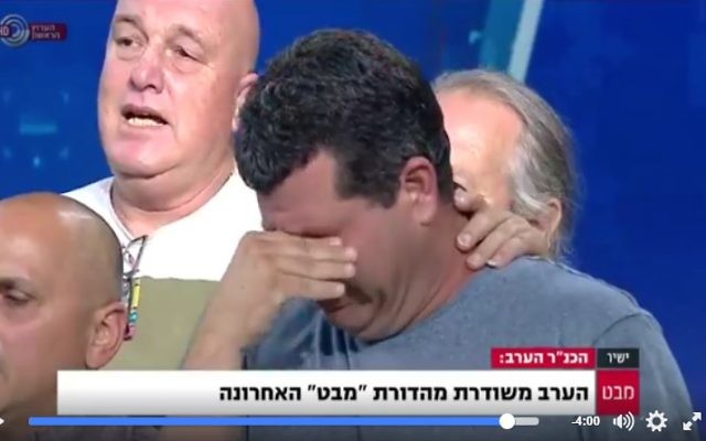 Employees of the Channel 1's Mabat news broadcast sing Hatikvah during their final news broadcast on May 9, 2017 (Screencapture/Facebook/Channel 1)