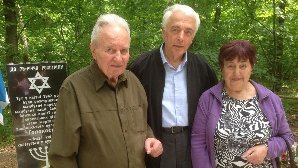 Standing in front of the Bnei memorial to 1,000 children killed in the forest of Uman, Ukraine in April 1942 are (from left) Karl Epstein, head of Uman's Jewish community, Dr. Boris Zabarko, chairman of the Ukrainian Holocaust survivors' association, and Nina Levenberg, who survived a mass killing by the Nazis and was rescued by a Ukrainian, March 9, 2017. (Photo by Sue Surkes)