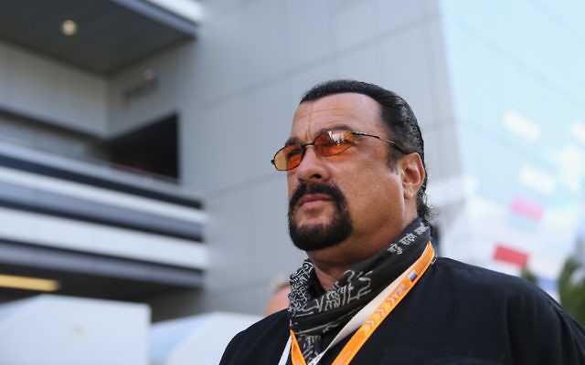 Actor Steven Seagal attends qualifying ahead of the Russian Formula One Grand Prix at Sochi Autodrom on October 11, 2014 in Sochi, Russia (Clive Mason/Getty Images via JTA)