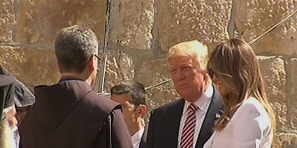 Donald Trump, center, and his wife Melania Trump, right, speaking with monks outside the Church of the Holy Sepulchre in Jerusalem's Old City on May 22, 2017. (screen capture: Channel 2)