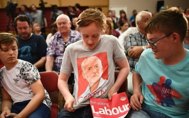 Illustrative: A young Labour Party supporter shows off his T-shirt with the face of Jeremy Corbyn, before an election campaign speech by the opposition leader in Basildon on June 1, 2017. (AFP/Justin Tallis)