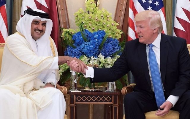 This file photo taken on May 21, 2017 shows US President Donald Trump (R) shaking hands with Qatar's Emir Sheikh Tamim Bin Hamad Al-Thani, during a bilateral meeting at a hotel in the Saudi capital Riyadh. (AFP Photo/Mandel Ngan)