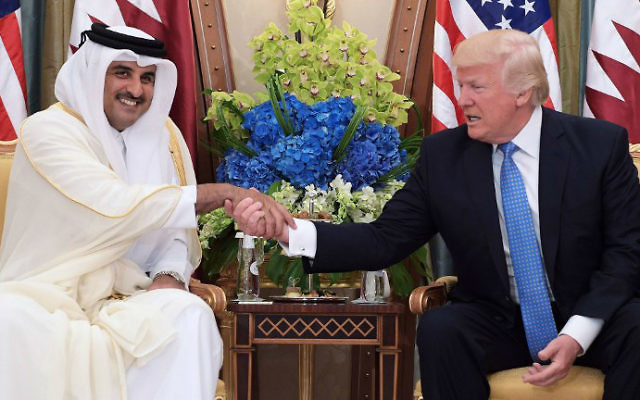 US President Donald Trump, right, shaking hands with Qatar's Emir Sheikh Tamim Bin Hamad Al-Thani, during a bilateral meeting at a hotel in the Saudi capital Riyadh, May 21, 2017. (Mandel Ngan/AFP)