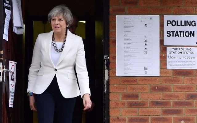 Britain's Prime Minister Theresa May leaves a polling station after casting her ballot paper in Sonning, west of London, on June 8, 2017, as Britain holds a general election.  (Ben Stansall/AFP)