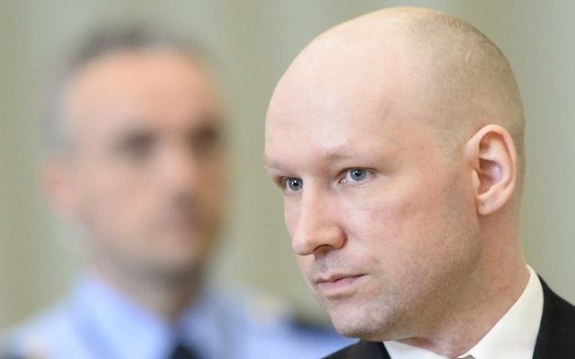 This file photo taken on March 15, 2016 shows Norwegian mass killer Anders Behring Breivik (R) returning to a makeshift court in Skien prisons gym after a lunch break in Skien, some 130 km south west of Oslo, for his lawsuit against the Norwegian state ( AFP PHOTO / JONATHAN NACKSTRAND)