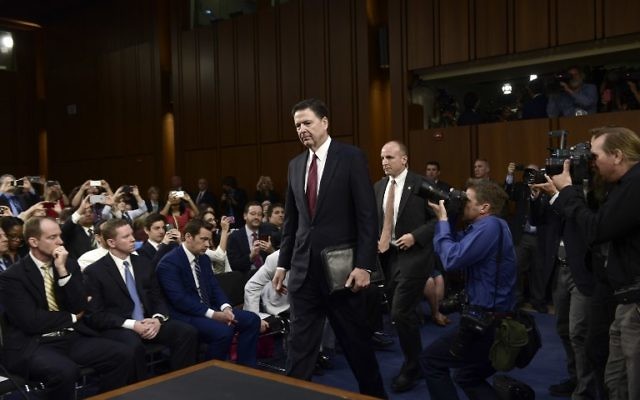 Former FBI Director James Comey arrives to testify during a US Senate Select Committee on Intelligence hearing on Capitol Hill in Washington,DC, June 8, 2017. ( AFP PHOTO / Brendan Smialowski)