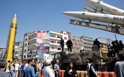 A Shahab-3 long range missile, left, and Zolfaghar missiles, right, are displayed during a rally marking al-Quds (Jerusalem) Day in Tehran on June 23, 2017. (AFP Photo/Stringer)
