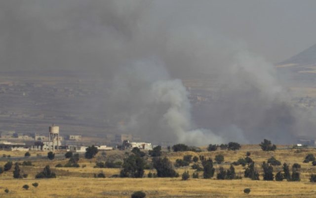 A picture taken from the Israeli Golan Heights shows smoke billowing from the Syrian side of the border on June 24, 2017. (AFP PHOTO / JALAA MAREY)