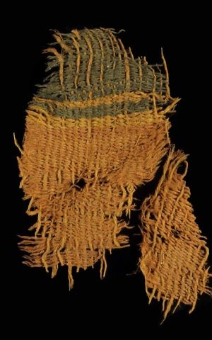 Woolen textile from the Timna Valley excavation decorated with stripes of red produced from dyers’ madder and blue made from a plant-based indigo that probably derived from woad (photo: Clara Amit, courtesy of the Israel Antiquities Authority)