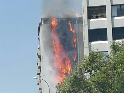 A fire rages in a 15-story apartment building in Ramat Gan, June 13, 2016. (Screen capture: Channel 2)