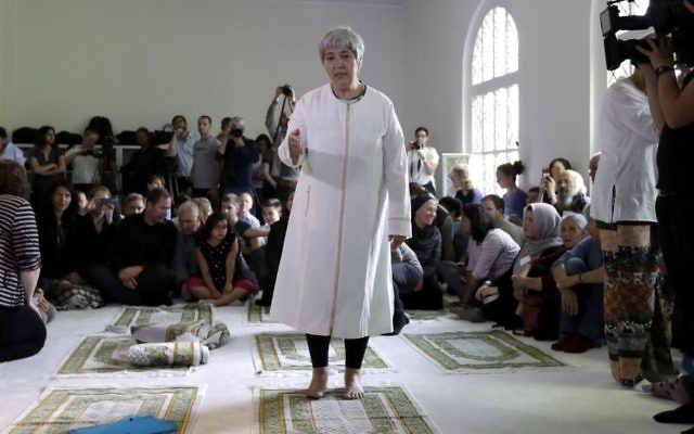 Seyran Ates, standing at center, founder of the Ibn-Rushd-Goethe-Mosque gestures during the opening of the mosque in Berlin, Germany, Friday, June 16, 2017. (AP/Michael Sohn)