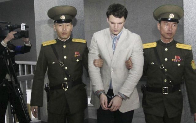 Otto Warmbier, center, is escorted at the Supreme Court in Pyongyang, North Korea, March 16, 2016. (AP Photo/Jon Chol Jin)