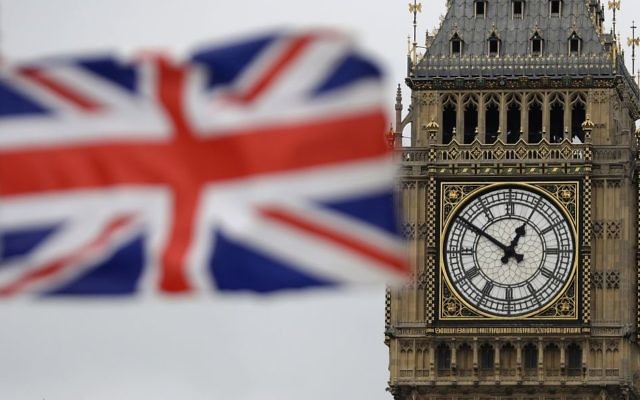 A British flag is shown near Big Ben's clock tower in front of the Houses of Parliament in central London, March 29, 2017. (AP Photo/Matt Dunham)