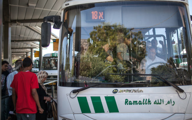 Israeli-Arabs and Palestinians seen at the palestinian bus station in East Jerusalem, boarding the bus to Ramallah. (Photo by Noam Moskowitz / Flash 90) 