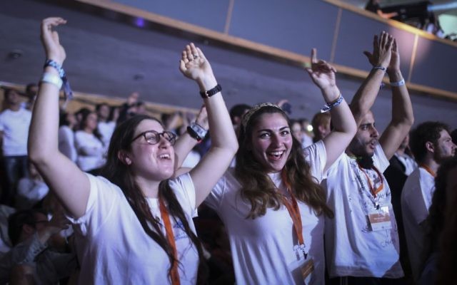Participants in a Taglit Birthright program celebrate  at an event held at the International Conference Center in Jerusalem on January 14, 2015. (Hadas Parush/Flash90)