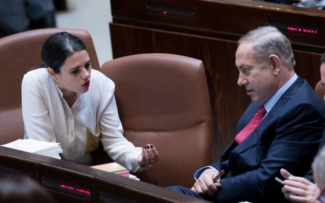 Prime Minister Benjamin Netanyahu, right, speaks with then-justice minister Ayelet Shaked in the Knesset, December 21, 2016. (Yonatan Sindel/Flash90)