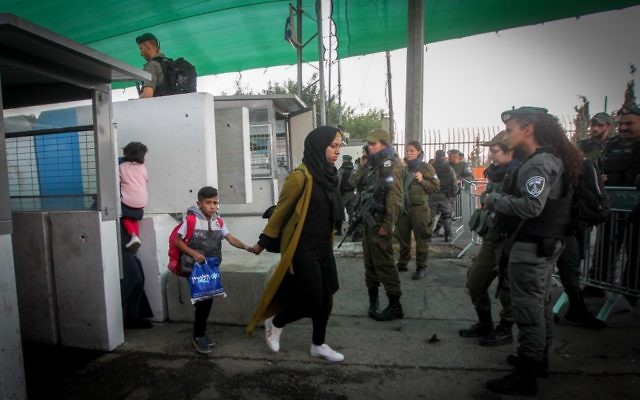 Illustrative image of Palestinians crossing the Bethlehem checkpoint, on June 23, 2017. (Wisam Hashlamoun/FLASH90)