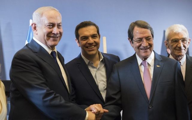 Prime Minister Benjamin Netanyahu, left, Greek Prime Minister Alexis Tsipras, center, and Cypriot President Nicos Anastasiades shake hands during their meeting in Thessaloniki, Greece's second largest city, on June 15, 2017. (AP Photo/Giannis Papanikos)