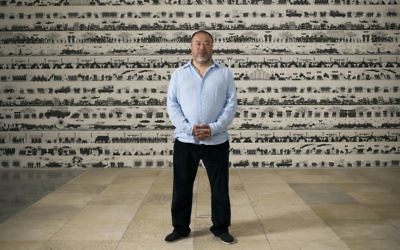 Chinese artist Ai Weiwei poses before the opening of his exhibition in the Israel Museum in Jerusalem, Thursday, June 1, 2017. (AP Photo/Dan Balilty)