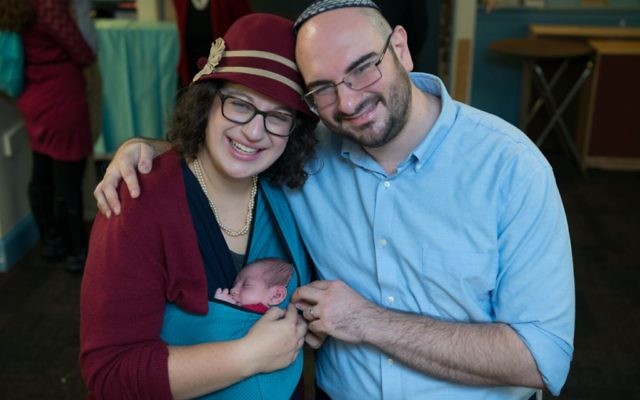 Rabbi Sarah Mulhern with her husband and newborn baby. (Courtesy of Mulhern/via JTA)