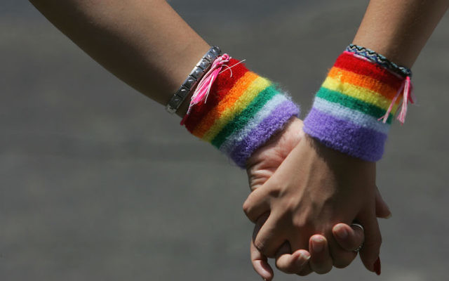 A lesbian couple hold hands during the annual Gay Pride rally, on June 8, 2007 Tel Aviv. (David Silverman/Getty Images via JTA)