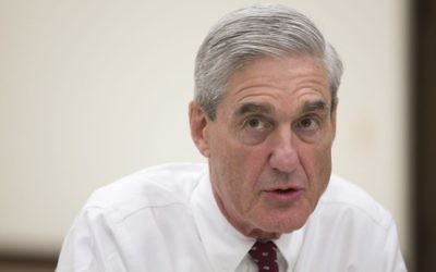 In an Aug. 21, 2013 file photo, former FBI director Robert Mueller speaks during an interview at FBI headquarters in Washington DC. (AP Photo/Evan Vucci, File)