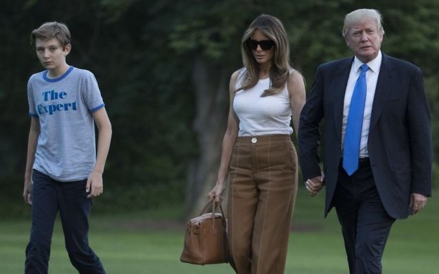 President Donald Trump, first lady Melania Trump and their son Barron Trump walk from Marine One across the South Lawn to the White House in Washington, June 11, 2017, as they return from Bedminster, N.J. (AP/Carolyn Kaster)