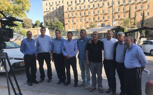 Settler leaders outside the Prime Minister's Office in Jerusalem after a meeting with Prime Minster Benjamin Netanyahu. (Jacob Magid/Times of Israel)