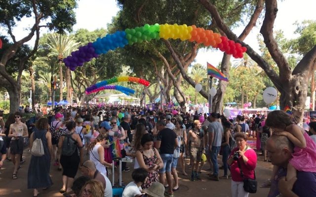 Revelers assemble ahead of the Gay Pride Parade in Tel Aviv on Friday, June 9, 2017 (Luke Tress/Times of Israel)
