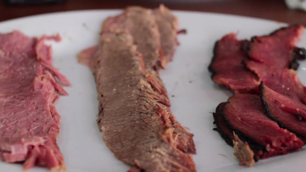 A trio of pastrami, roast beef, and corned beef from David's Brisket House. (YouTube/Screenshot)