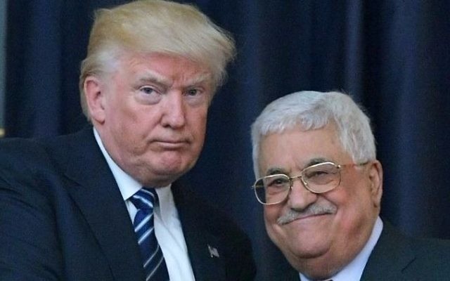 US President Donald Trump, left, and Palestinian leader Mahmoud Abbas pose for a photograph during a joint press conference at the presidential palace in the West Bank city of Bethlehem on May 23, 2017. (AFP/Mandel Ngan)