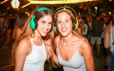Getting the groove on with the Rabin Square earphones party for White Night, Thursday night, June 29 (Courtesy Guy Yechiely)