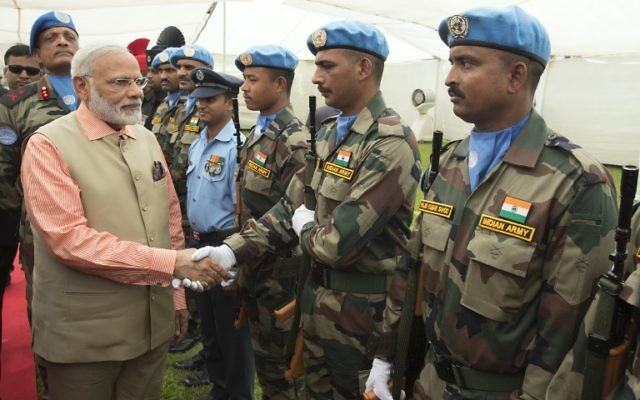 Indian Prime Minister Narendra Modi greets members of the Indian contingent of UNIFIL during a visit at the the Indian Army Cemetery of the World War I in Haifa, on July 6, 2017. (AFP/JACK GUEZ)