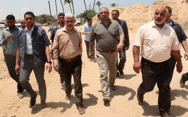 Chief of the Hamas terror group in Gaza Yahya Sinwar (C-L) visits the border with Egypt, in the southern Gaza Strip city of Rafah, on July 6, 2017. (AFP Photo/Said Khatib)