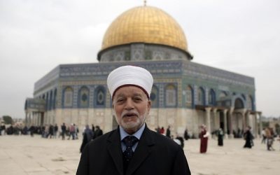 This file photo taken on November 6, 2015 shows Jerusalem's Mufti Mohammed Hussein posing in front of the Dome of the Rock mosque atTemple Mount in Jerusalem's Old City. (Ahmad Gharabli/AFP)
