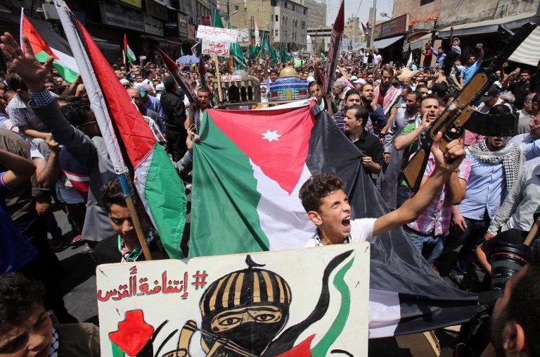 Jordanians shout slogans during a demonstration in Amman on July 21, 2017, protesting against new Israeli security measures implemented at the Temple Mount. (AFP/Khalil Mazraawi)