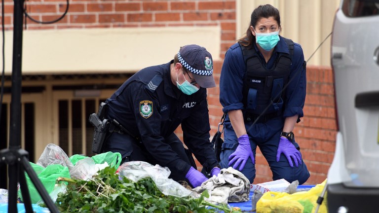 Police search for evidence at a block of flats in the Sydney suburb of Lakemba on July 31, 2017, after counter-terrorism raids across the city on the weekend. (WILLIAM WEST / AFP)