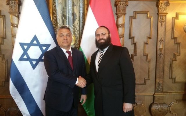 Hungarian Prime Minister Viktor Orban shakes hands with Rabbi Menachem Margolin on July 6, 2017. (European Jewish Association)