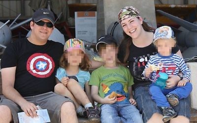 Elad Salomon, left, with his wife Michal and three of their kids. Elad was stabbed to death on July 21, 2017 in a terrorist attack at Halamish. (Courtesy)