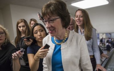 Sen. Susan Collins, R-Maine is surrounded by reporters as she heads to the Senate on Capitol Hill in Washington, Thursday, July 27, 2017. (AP Photo/J. Scott Applewhite)