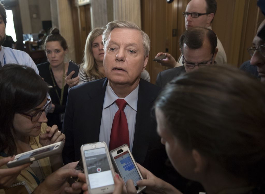 Sen. Lindsey Graham (R-SC) is surrounded by reporters as he arrives at the Senate chamber on Capitol Hill in Washington, Thursday, July 27, 2017. (AP Photo/J. Scott Applewhite)