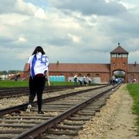 A student on a trip to the Auschwitz-Birkenau camp site in modern-day Poland on April 27, 2014. (Yossi Zeliger/Flash90)