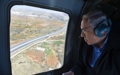 Prime Minister Benjamin Netanyahu makes his way by helicopter to the Etzion Bloc in the West Bank on November 23, 2015 (Haim Zach/GPO)