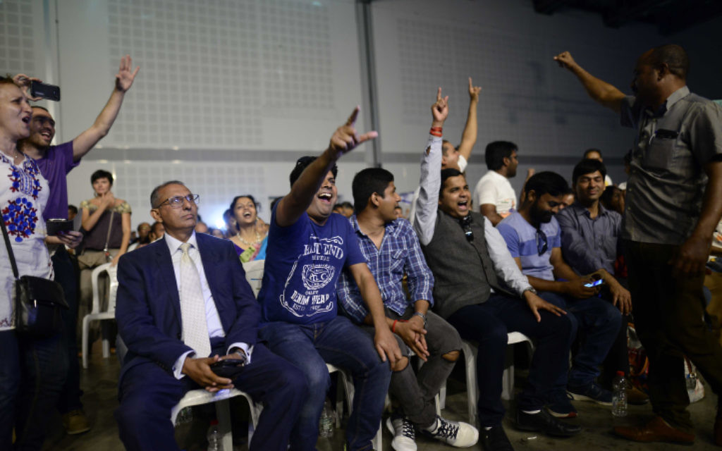 Members of the Indian community in Israel celebrate during an event marking 25 years of good relations between Israel and India during the official visit of the Indian Prime Minister Narendra Modi, at the Convention Center in Tel Aviv, on July 5, 2017. (Tomer Neuberg/Flash90)