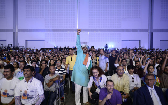 Members of the Indian community in Israel celebrate during an event marking 25 years of good relations between Israel and India during the official visit of the Indian Prime Minister Narendra Modi, at the Convention Center in Tel Aviv, on July 5, 2017. (Tomer Neuberg/Flash90)