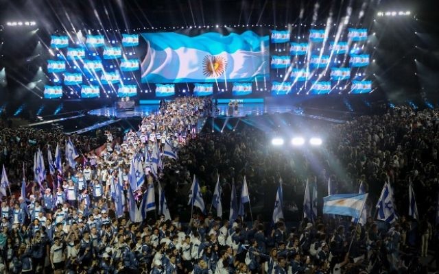 Jewish athletes participating in the 20th Maccabiah Games, wave their national flag during the opening ceremony of the Maccabiah Games in Jerusalem, July 6, 2017. (Yonatan Sindel/Flash90)