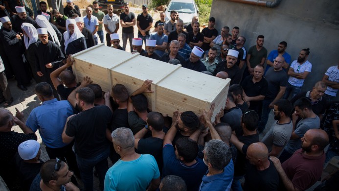 Family and friends carry the coffin of Israeli Druze police officer Haiel Sitawe, 30, during his funeral in the northern village of Maghar, July 14, 2017. Haiel Sitawe and Kamil Shnaan where killed early on Friday in a shooting attack near the Temple Mount complex in the Old City of Jerusalem. (Basel Awidat/Flash90) 